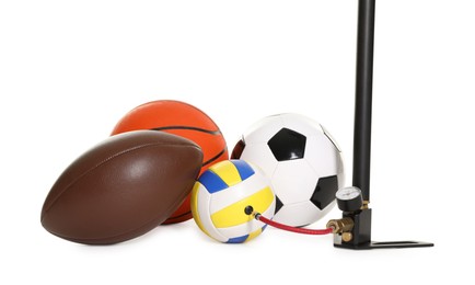 Photo of Different sport balls and manual air pump isolated on white