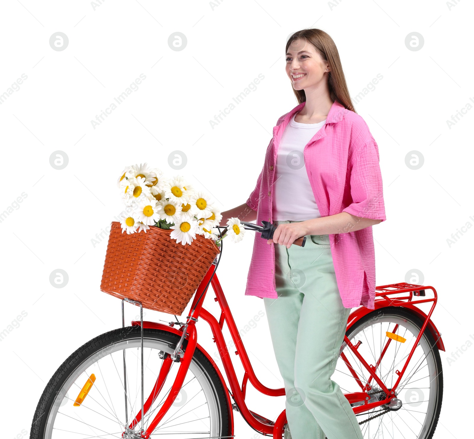 Photo of Smiling woman and bicycle with basket of flowers against white background