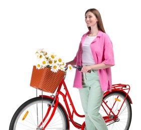 Photo of Smiling woman and bicycle with basket of flowers against white background