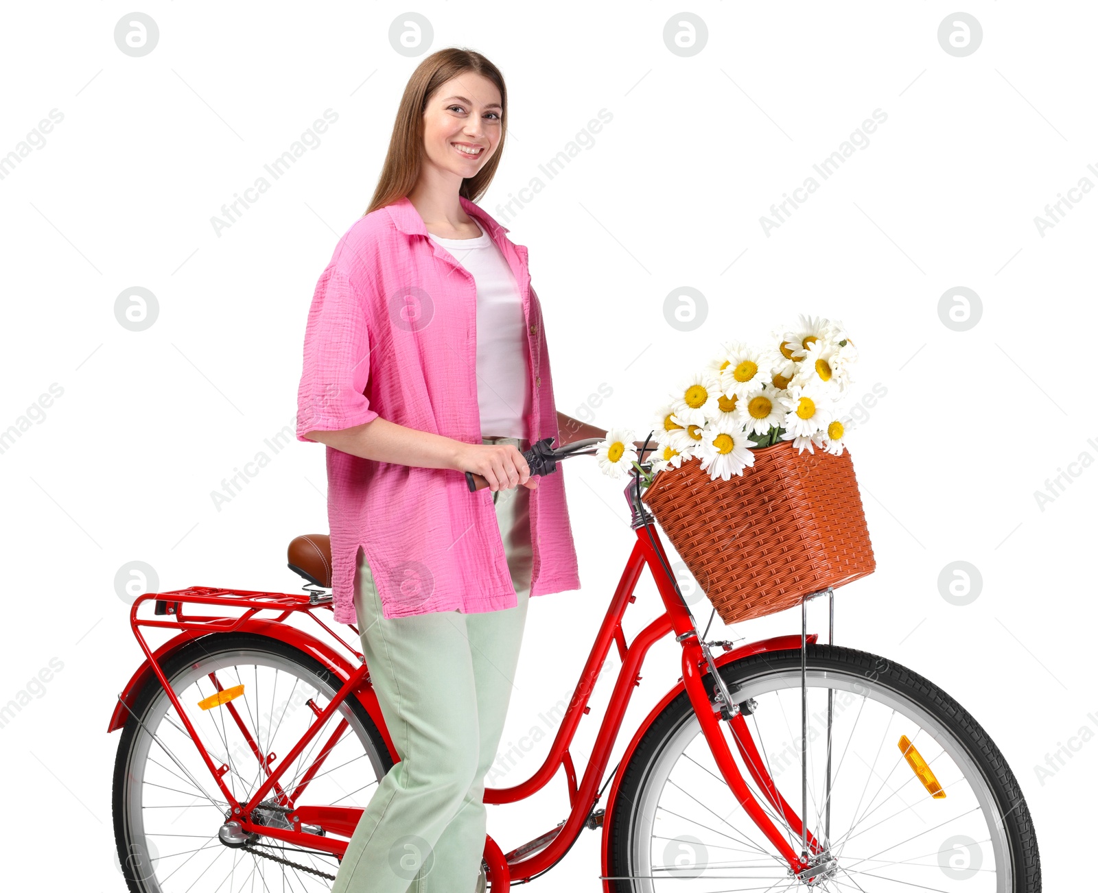 Smiling woman and bicycle with basket of flowers against white background Photo of Smiling woman and bicycle with basket of flowers against white background