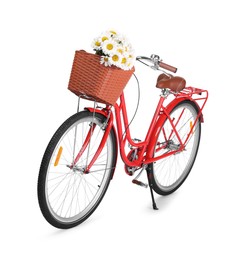 Photo of Bicycle with basket of beautiful flowers isolated on white