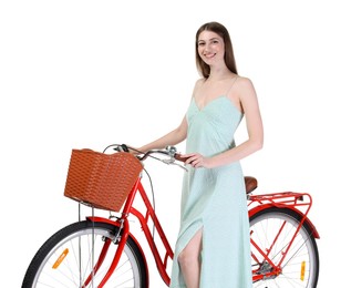 Photo of Smiling woman in dress and bicycle with basket against white background