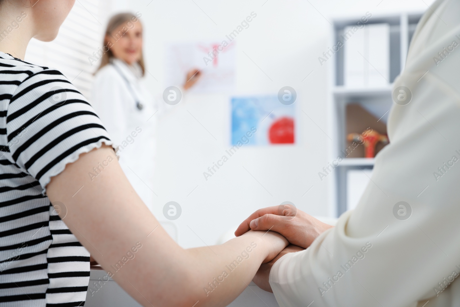 In vitro fertilization (IVF). Couple having consultation with doctor in reproductive clinic, closeup Photo of In vitro fertilization (IVF). Couple having consultation with doctor in reproductive clinic, closeup