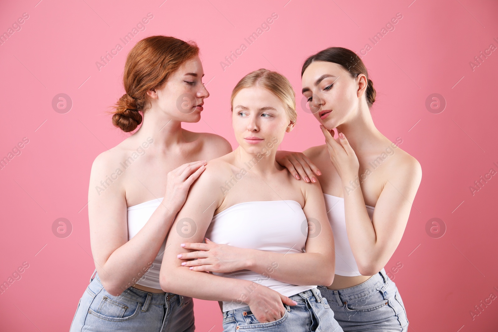 Beautiful women with different hair colors on pink background Photo of Beautiful women with different hair colors on pink background