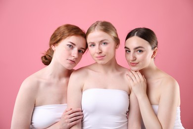 Photo of Beautiful women with different hair colors on pink background