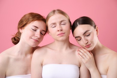 Photo of Beautiful women with different hair colors on pink background