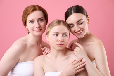 Photo of Beautiful women with different hair colors on pink background