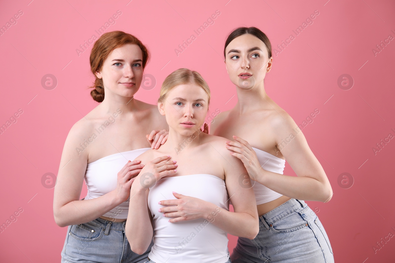 Photo of Beautiful women with different hair colors on pink background