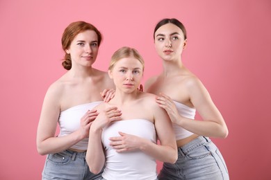 Photo of Beautiful women with different hair colors on pink background