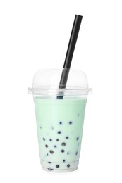Photo of Tasty milk bubble tea in plastic cup isolated on white
