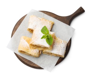 Photo of Pieces of tasty apple strudel with powdered sugar and mint isolated on white, top view