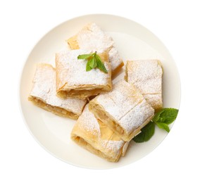 Photo of Pieces of tasty apple strudel with powdered sugar and mint isolated on white, top view