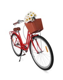 Photo of Bicycle with basket of beautiful flowers isolated on white