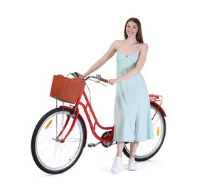 Photo of Smiling woman in dress and bicycle with basket against white background