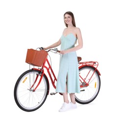 Photo of Smiling woman in dress and bicycle with basket against white background