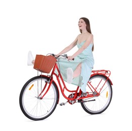 Photo of Happy woman riding bicycle with basket on white background