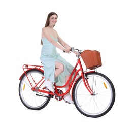 Photo of Smiling woman riding bicycle with basket on white background