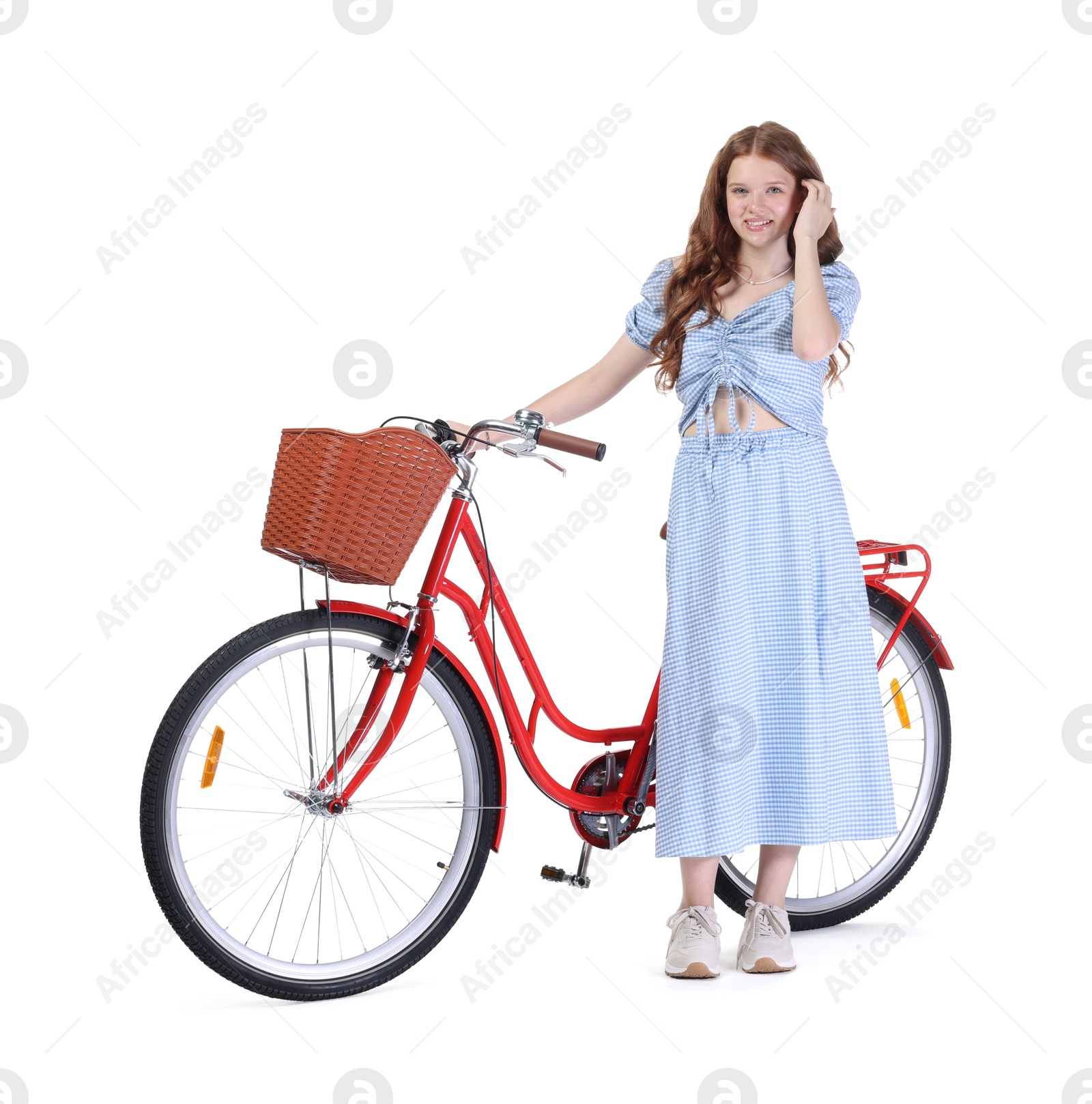 Photo of Smiling teenage girl and bicycle with basket on white background