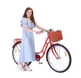 Photo of Smiling teenage girl and bicycle with basket on white background