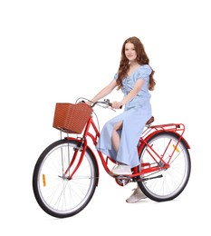 Photo of Beautiful teenage girl posing on bicycle with basket against white background