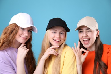 Photo of Beautiful women with different hair colors on light blue background