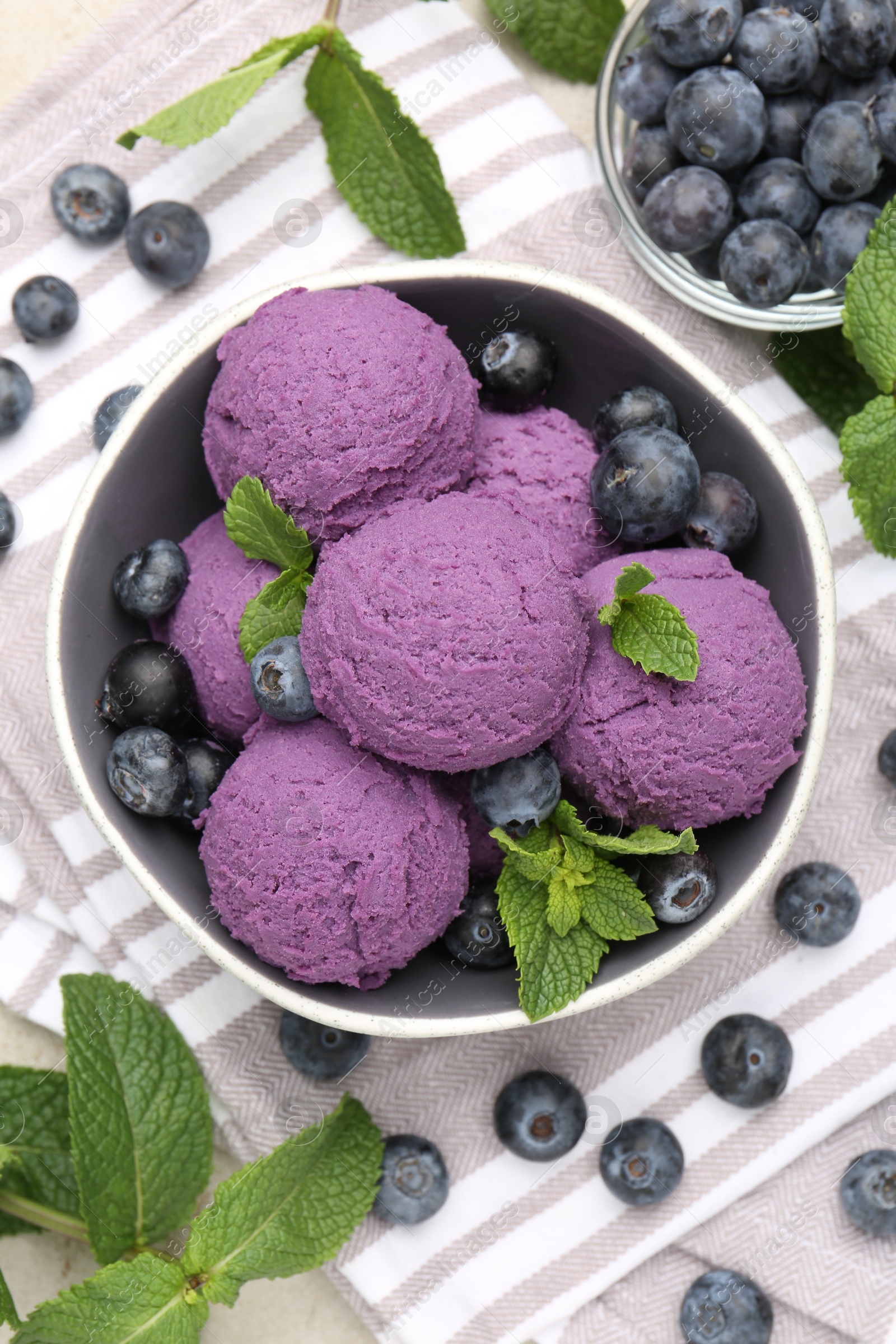 Photo of Tasty sorbet with blueberries and mint on table, flat lay