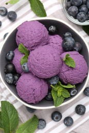 Photo of Tasty sorbet with blueberries and mint on table, flat lay