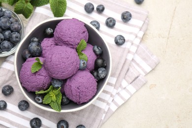 Photo of Tasty sorbet with blueberries and mint on light grey table, flat lay. Space for text