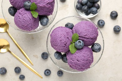Photo of Tasty sorbet with blueberries and mint on light grey table, flat lay
