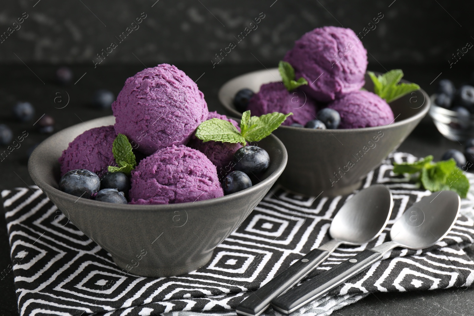 Tasty sorbet with blueberries and mint on table, closeup Photo of Tasty sorbet with blueberries and mint on table, closeup
