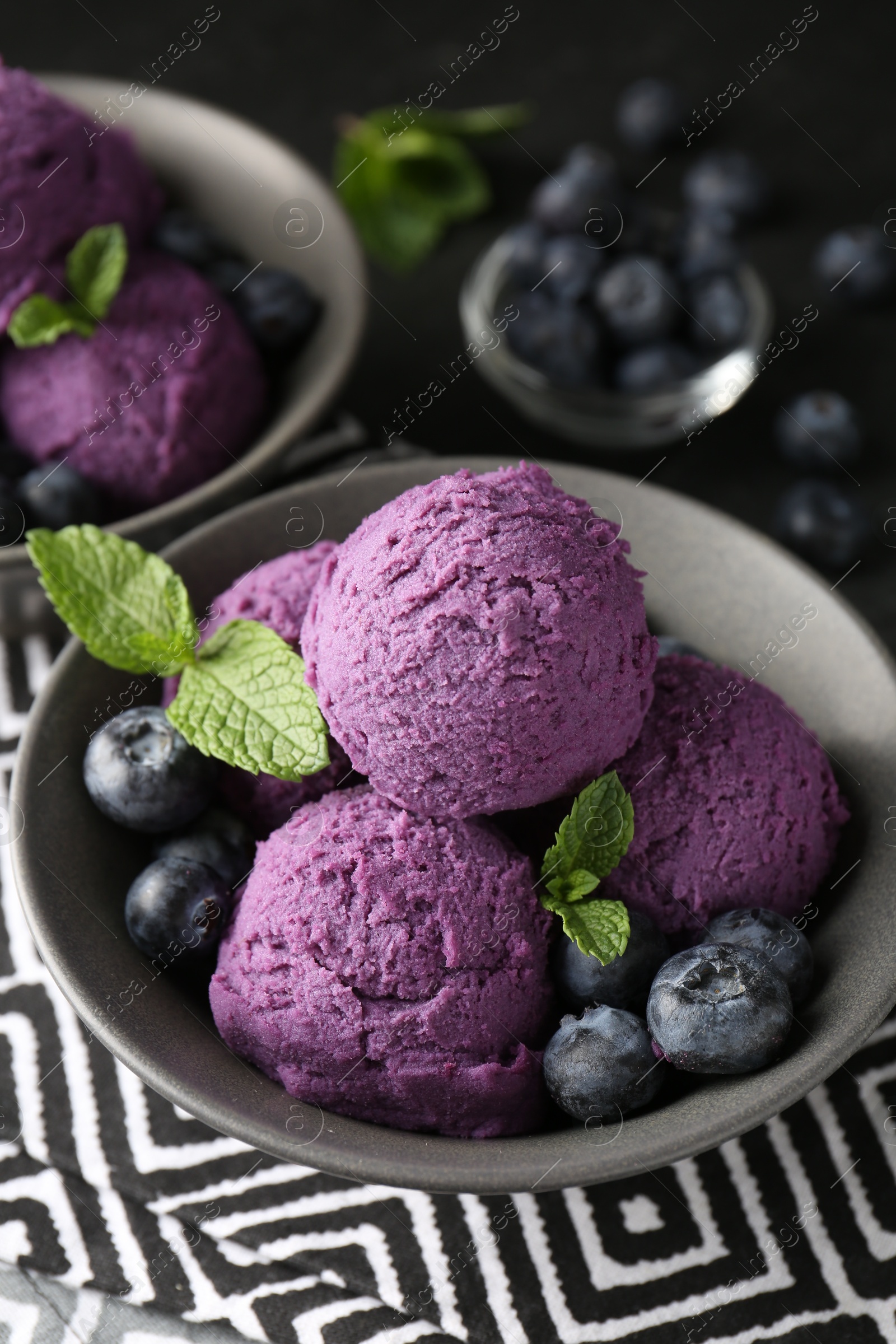Tasty sorbet with blueberries and mint on table, closeup Photo of Tasty sorbet with blueberries and mint on table, closeup