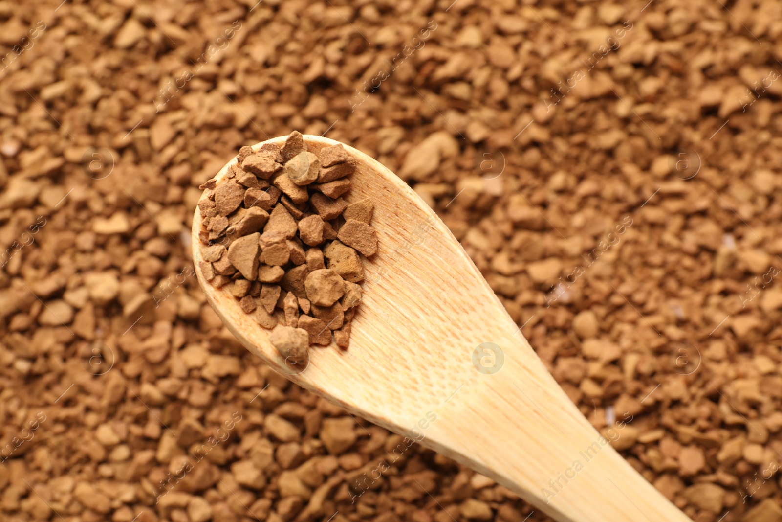 Spoon with aromatic instant coffee as background, closeup Photo of Spoon with aromatic instant coffee as background, closeup