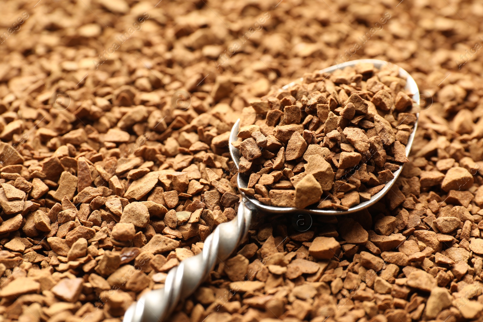 Spoon with aromatic instant coffee as background, closeup Photo of Spoon with aromatic instant coffee as background, closeup