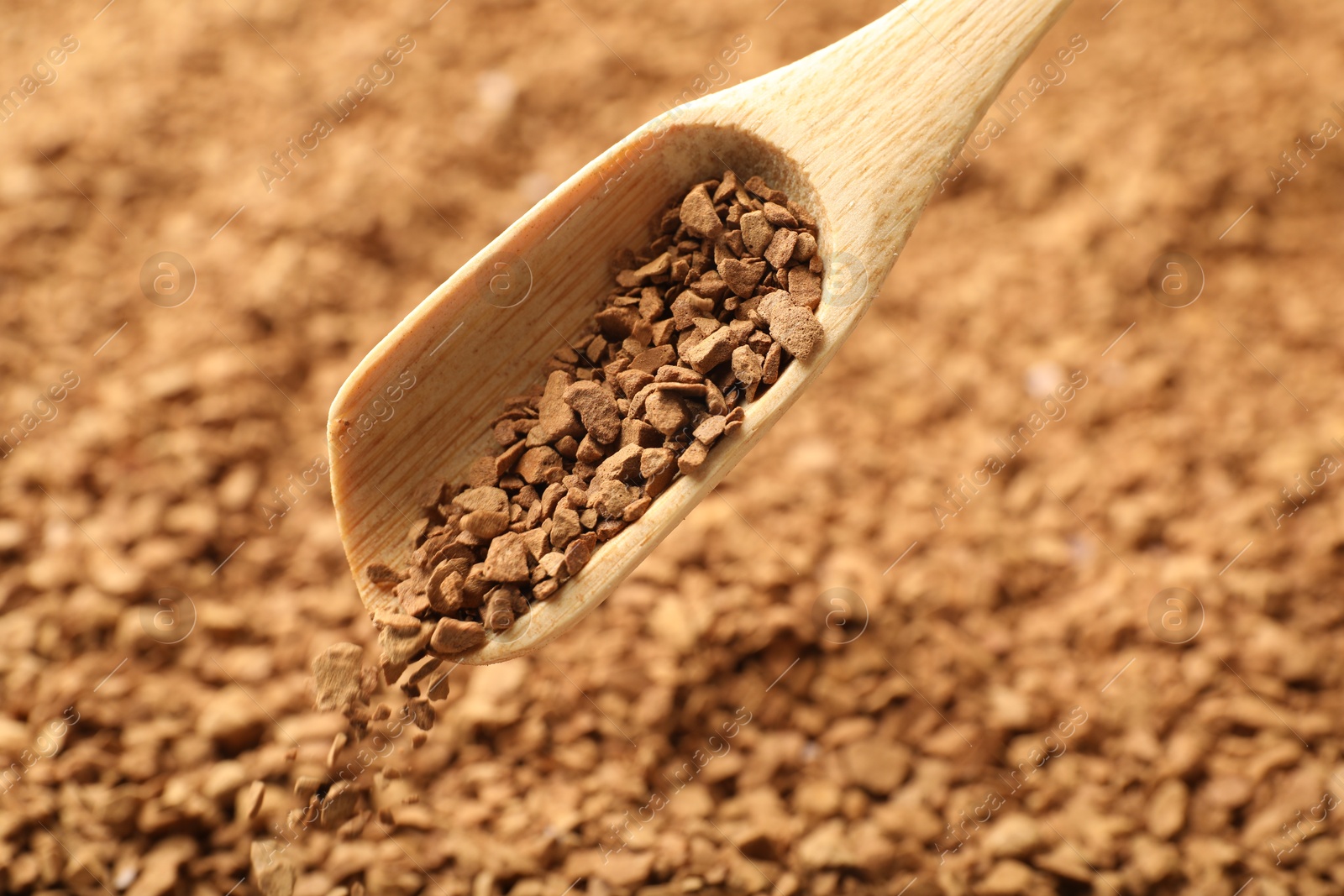 Spoon with aromatic instant coffee as background, closeup Photo of Spoon with aromatic instant coffee as background, closeup