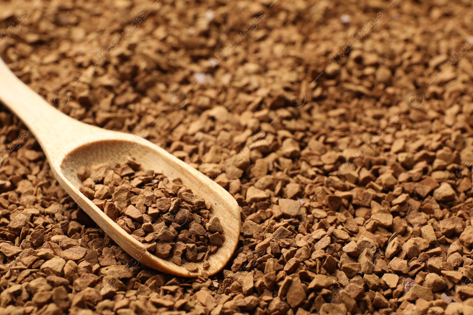 Spoon with aromatic instant coffee as background, closeup Photo of Spoon with aromatic instant coffee as background, closeup