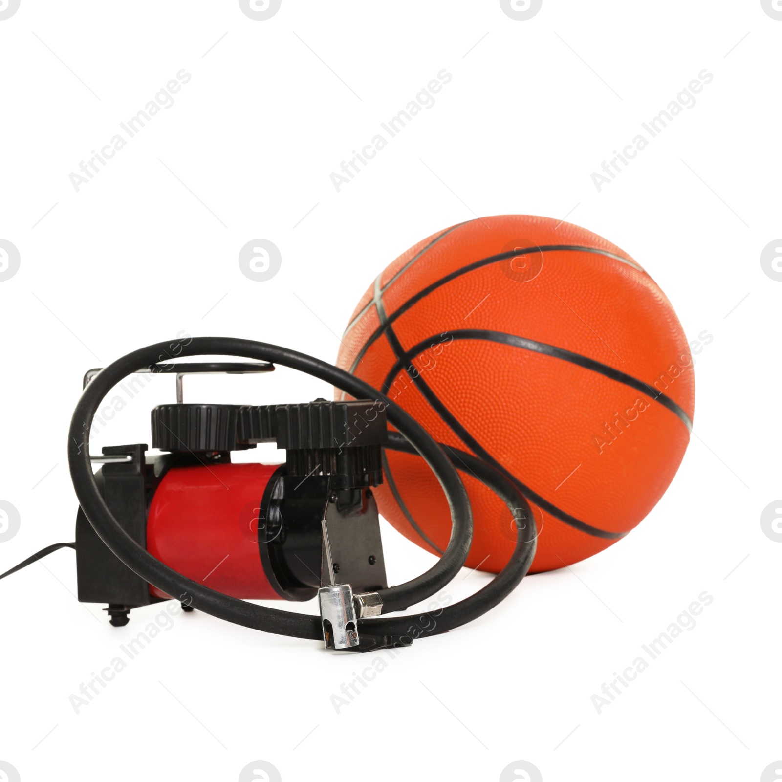 Basketball ball and air compressor isolated on white Photo of Basketball ball and air compressor isolated on white