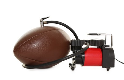 Photo of American football ball and air compressor isolated on white