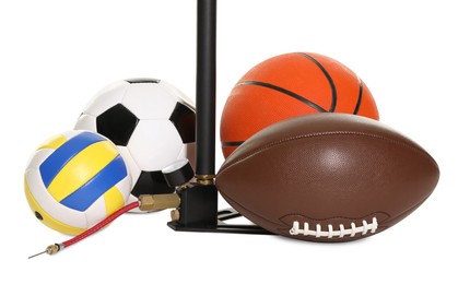 Photo of Different sport balls and manual air pump isolated on white