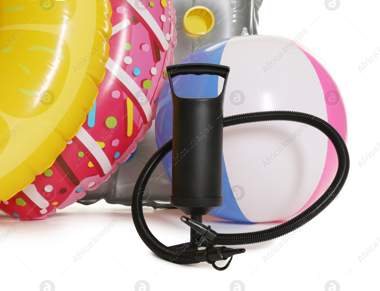 Inflatable rings, mattress, ball and manual air pump isolated on white Photo of Inflatable rings, mattress, ball and manual air pump isolated on white