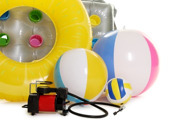 Photo of Inflatable ring, mattress, balls and air compressor isolated on white