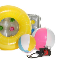 Photo of Inflatable ring, mattress, balls and air compressor isolated on white