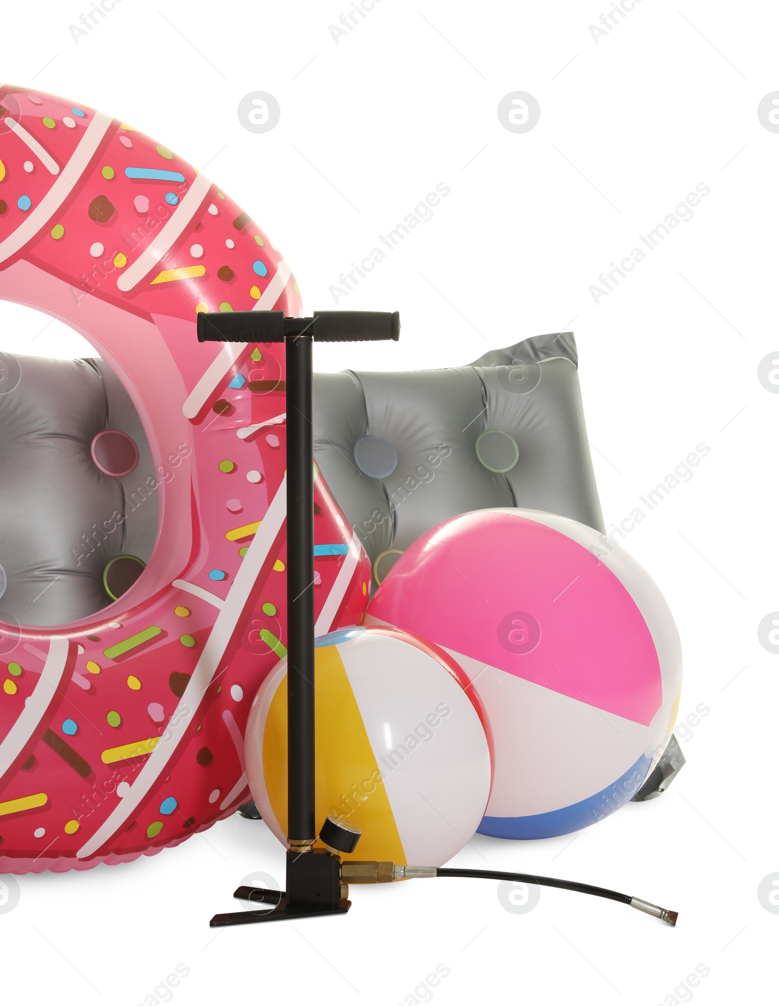 Inflatable ring, mattress, balls and manual air pump isolated on white Photo of Inflatable ring, mattress, balls and manual air pump isolated on white