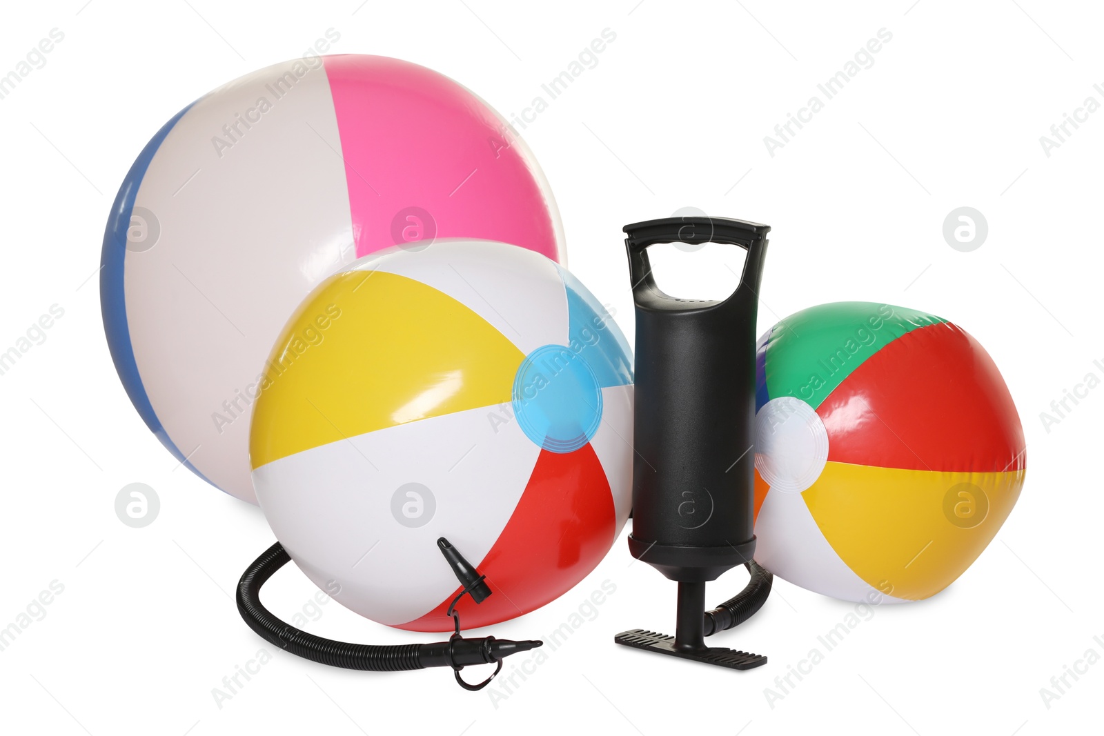 Inflatable balls and manual air pump isolated on white Photo of Inflatable balls and manual air pump isolated on white