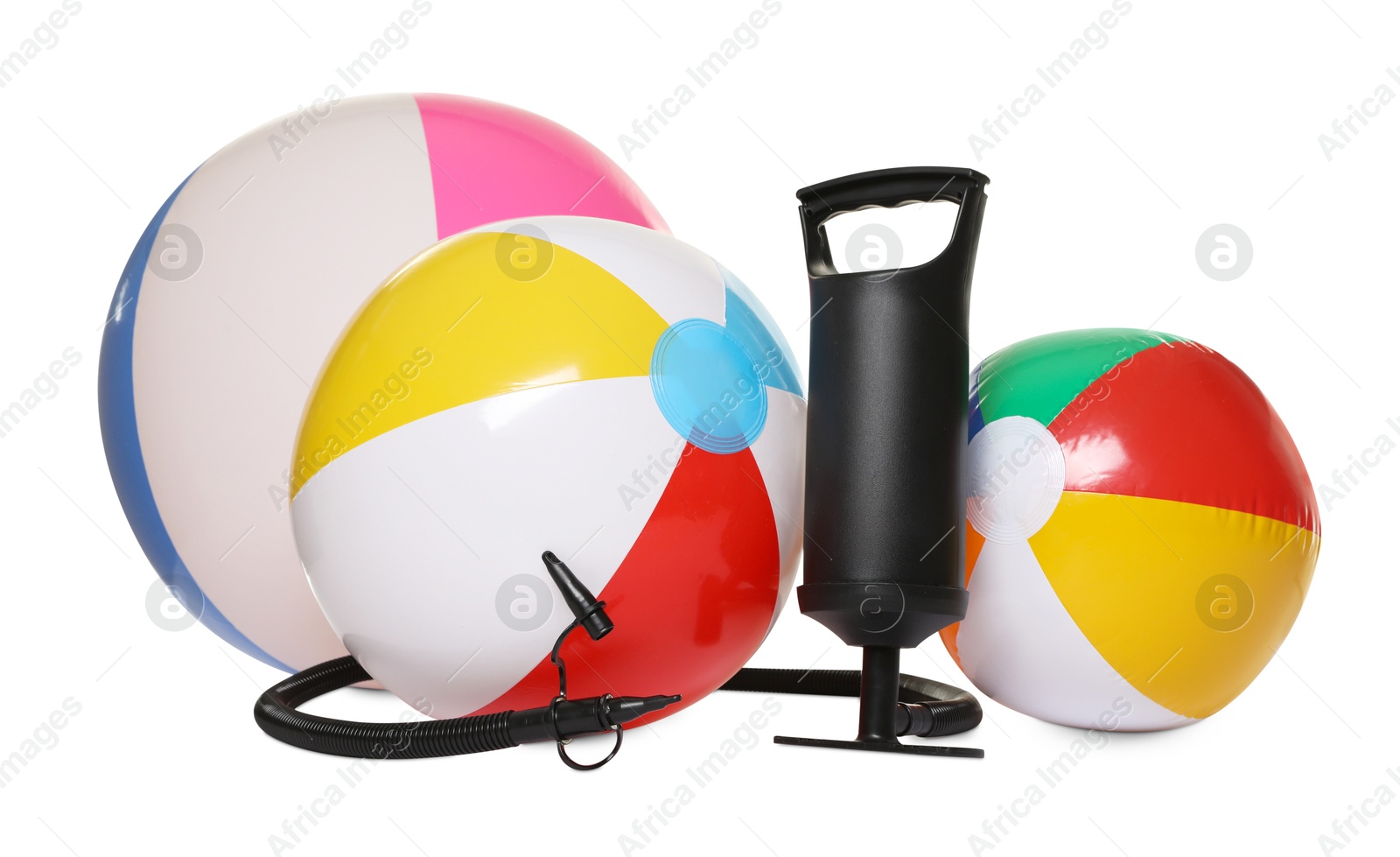 Inflatable balls and manual air pump isolated on white Photo of Inflatable balls and manual air pump isolated on white