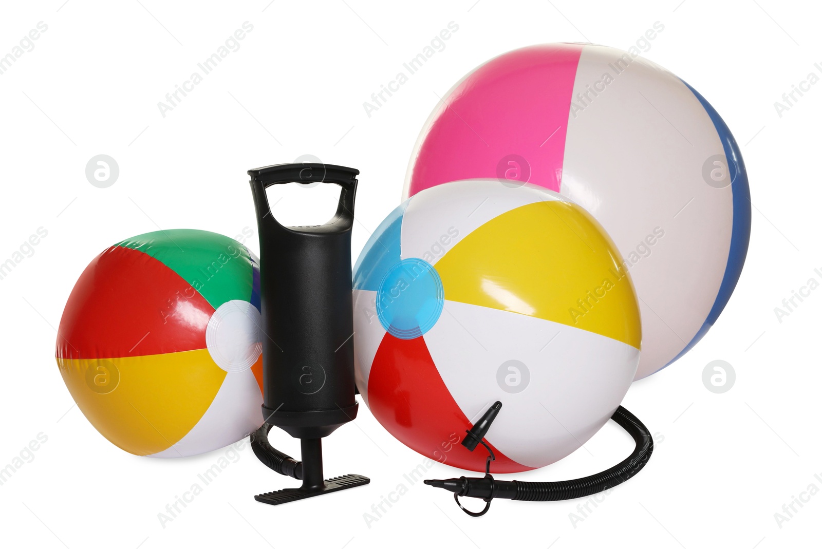 Inflatable balls and manual air pump isolated on white Photo of Inflatable balls and manual air pump isolated on white