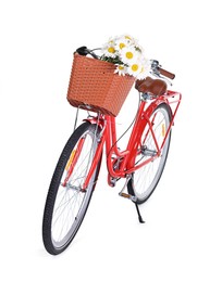 Photo of Bicycle with basket of beautiful flowers isolated on white
