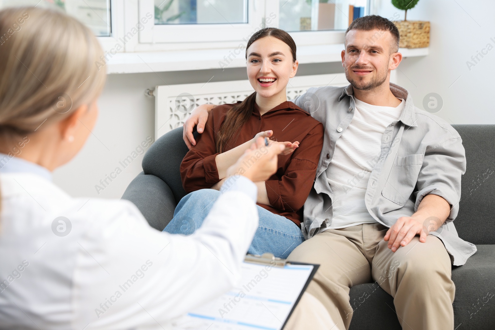 In vitro fertilization (IVF). Couple having consultation with doctor in reproductive clinic Photo of In vitro fertilization (IVF). Couple having consultation with doctor in reproductive clinic