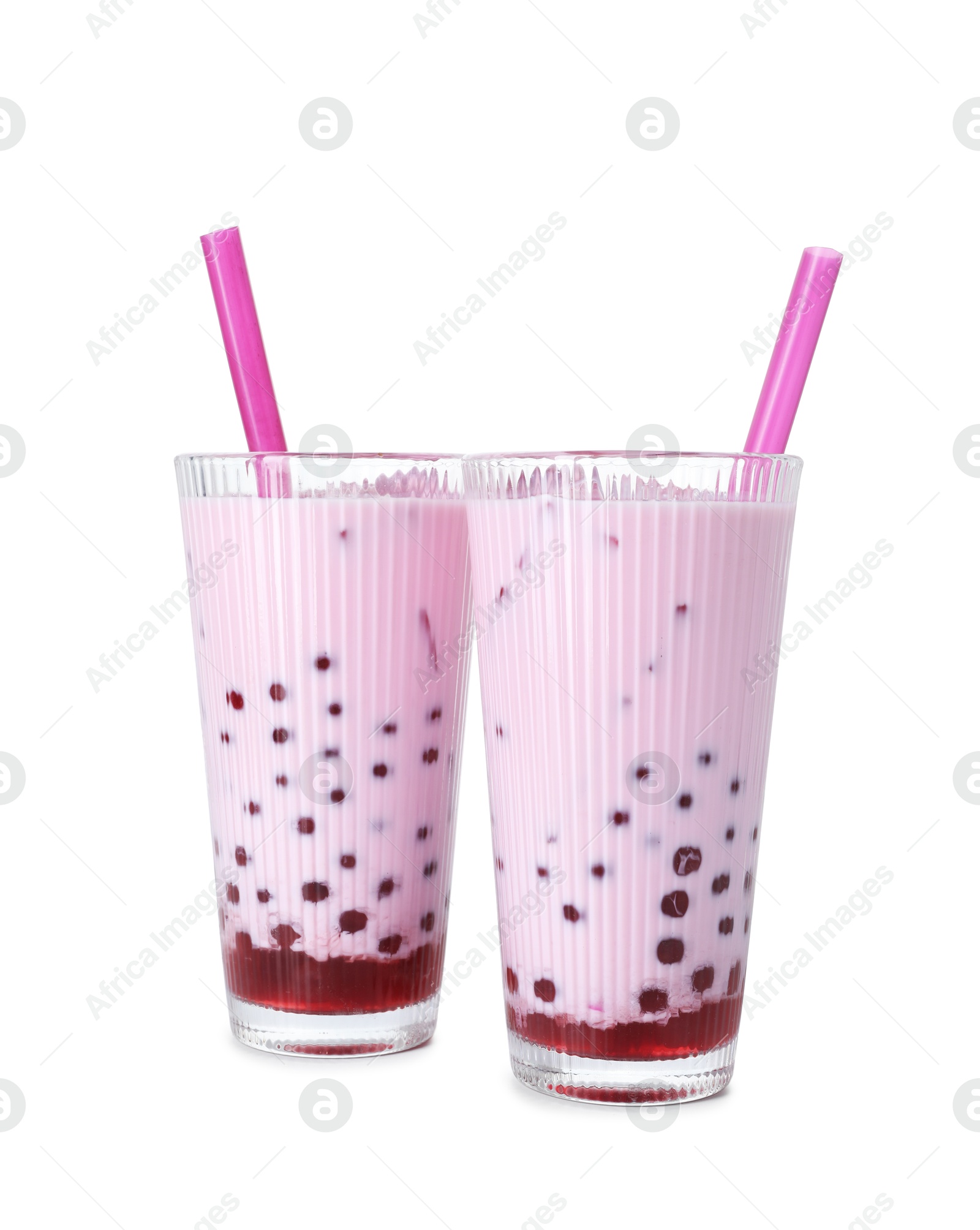 Tasty milk bubble tea in glasses isolated on white Photo of Tasty milk bubble tea in glasses isolated on white