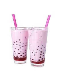 Photo of Tasty milk bubble tea in glasses isolated on white