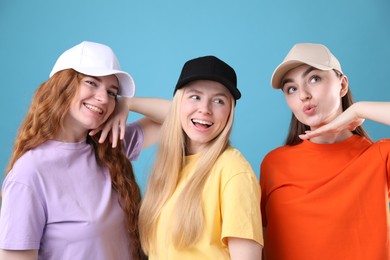 Photo of Beautiful women with different hair colors on light blue background